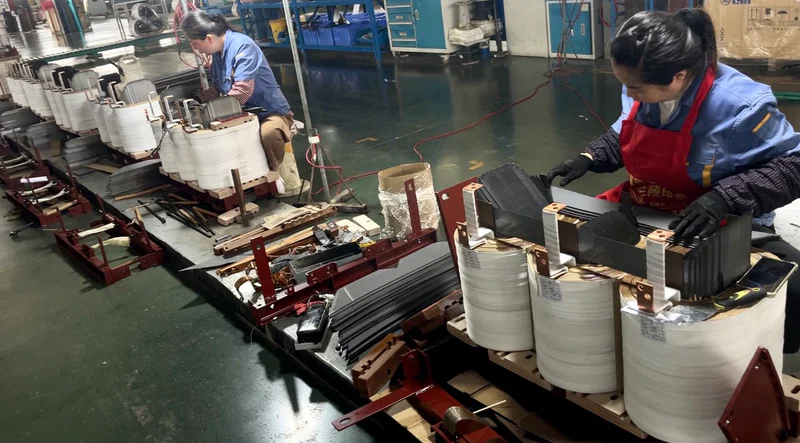 Insulation material assembly between windings and core