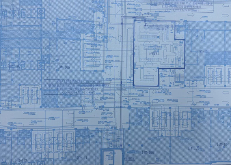 Engineer reviewing electrical single-line diagram and project specifications
