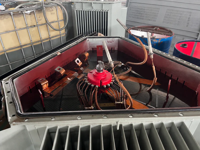 Oil immersed transformer dissipating heat through insulating oil and cooling radiators