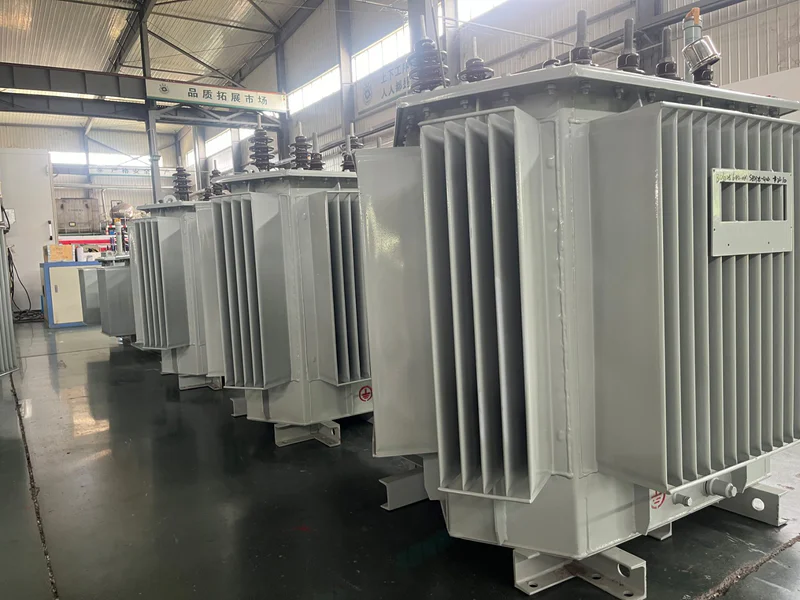 Oil immersed transformer with cooling radiators dissipating heat at an outdoor substation