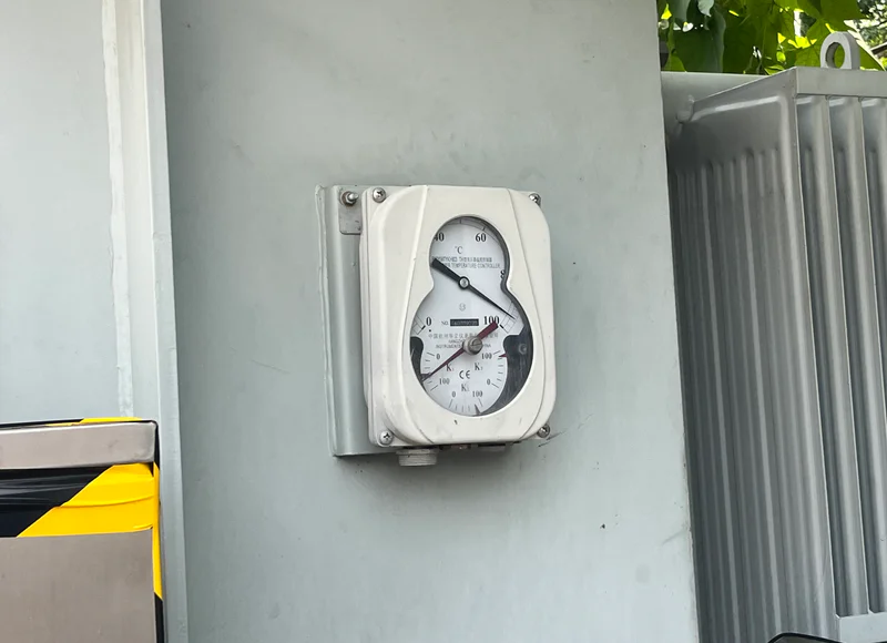 Oil temperature indicator gauge mounted on transformer